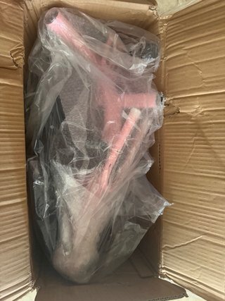 Triciclo rosa para niños con empujador