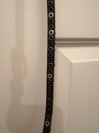 Cintura in pelle con bottoni metallici
