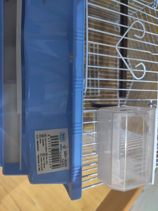 Jaula para pájaros con accesorios