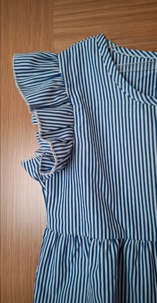 Blusa de niña, sin mangas. Talla 7 años.