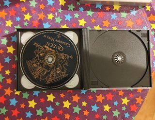 2cds y caja greatest hits Queen