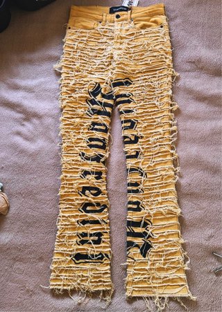 Pantalones MANZEDINI rasgados amarillos