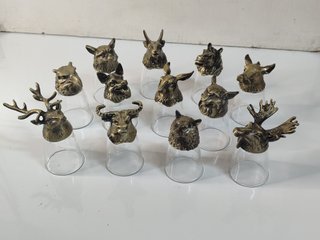 12 chupitos de cristal con base en metal animales