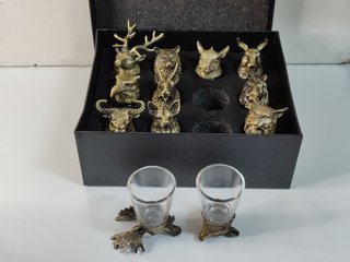 12 chupitos de cristal con base en metal animales