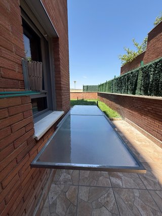 Mesa cristal y metal para jardín