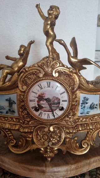 Reloj y candelabros bronce años 50
