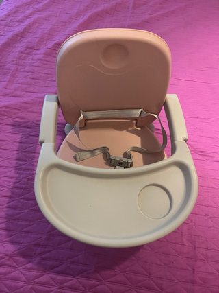 Trona de viaje para bebé rosa