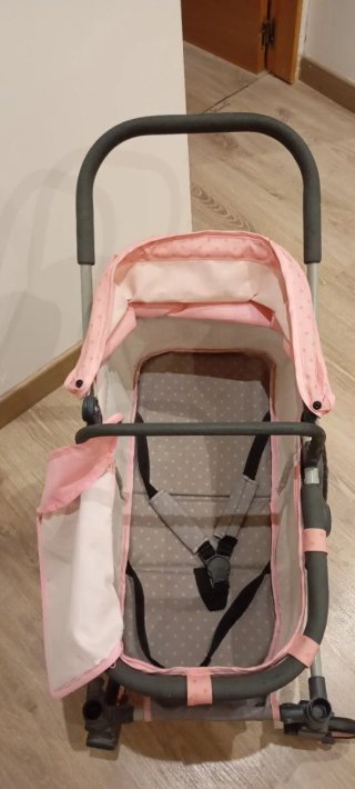 Carrito de muñecas rosa con lunares