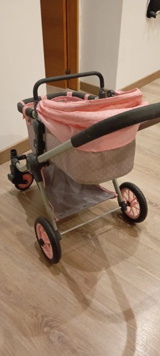 Carrito de muñecas rosa con lunares