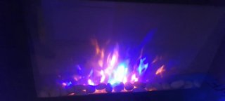 Chimenea moderna cristal y piedras