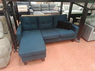 Sofá cama azul con otomana
