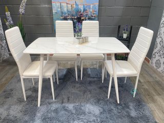 Mesa de comedor blanca con 4 sillas acolchadas