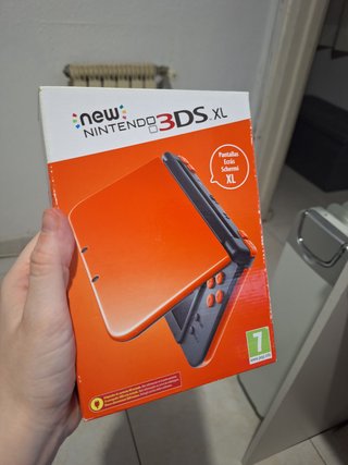 New Nintendo 3DS XL naranja con caja y manual