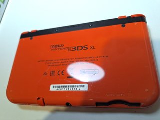 New Nintendo 3DS XL naranja con caja y manual