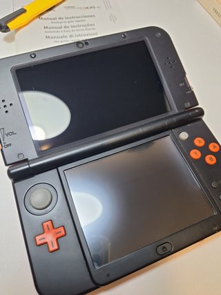 New Nintendo 3DS XL naranja con caja y manual