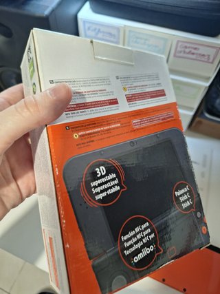 New Nintendo 3DS XL naranja con caja y manual