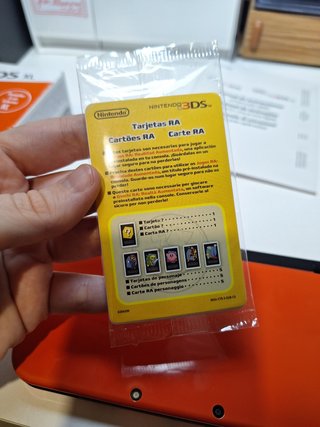 New Nintendo 3DS XL naranja con caja y manual