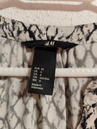 Camisa larga y oversize de chica talla S de H&M.