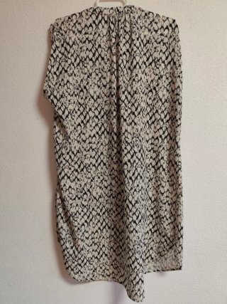Camisa larga y oversize de chica talla S de H&M.