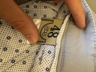 Pantaloni eleganti beige mai indossati