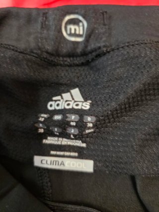 Mallas Adidas capri negras y rosas