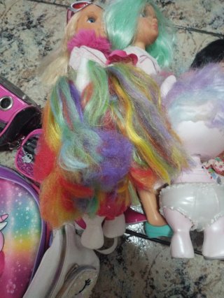 Dos muñecos Poopsie Unicornio