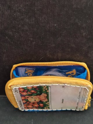 Monedero Pokémon Teddiursa con Carta Encapsulada