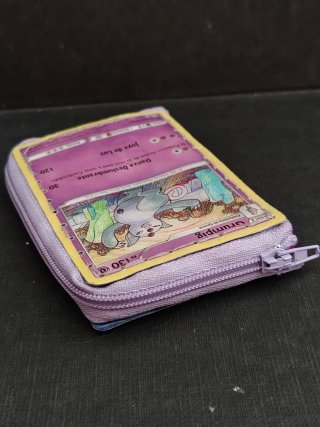 Monedero Pokémon Grumpig con Carta Encapsulada