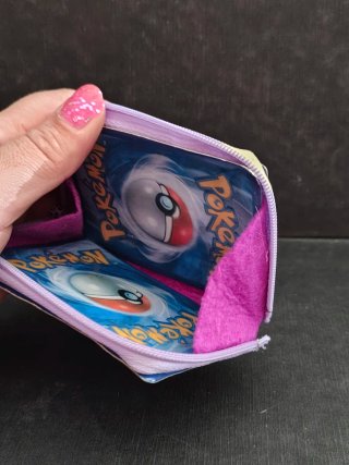 Monedero Pokémon Grumpig con Carta Encapsulada