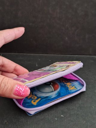 Monedero Pokémon Grumpig con Carta Encapsulada