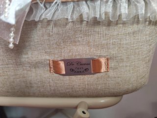 Carro de muñecas rosa con capota y bolso