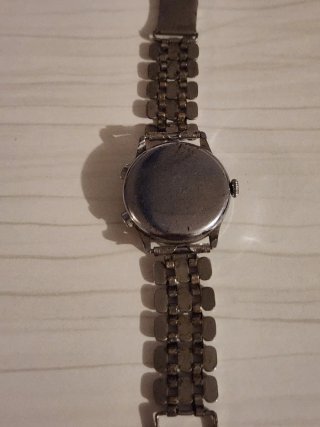 Reloj Rulo Watch Beige y Plateado funcionando