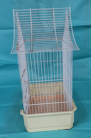 Jaula para pájaros con accesorios