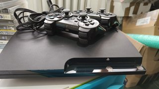 PlayStation 3 Slim + 11 Giochi PS3
