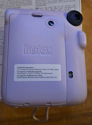 Instax Mini 12 lila + funda unicornios