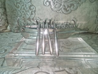 Barco de plata con remos