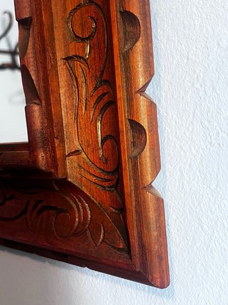 Espejo de madera tallada