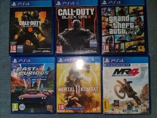 PS4 Slim 1TB Negra + Juegos  dos mandos y cargador