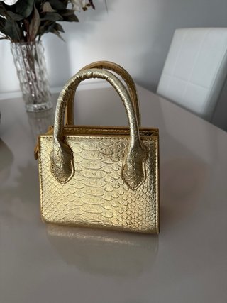 Mini bolso dorado efecto piel
