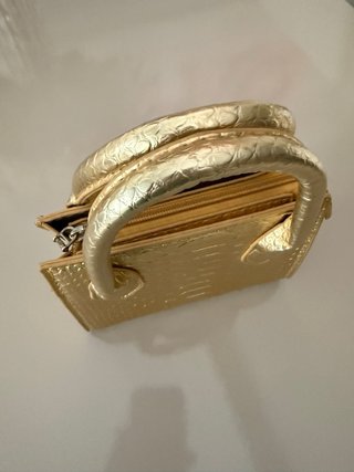 Mini bolso dorado efecto piel