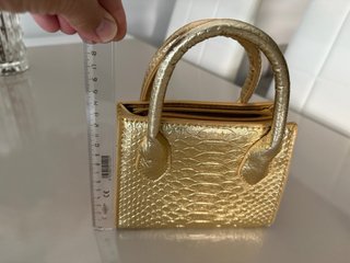 Mini bolso dorado efecto piel