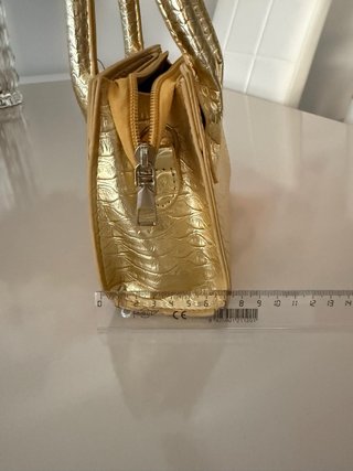 Mini bolso dorado efecto piel