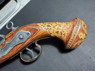 Pistola antigua decorativa
