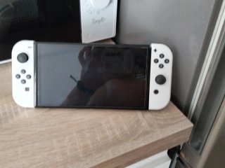 Nintendo Switch OLED con mando y funda