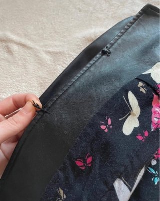 Bolero nero con fodera floreale