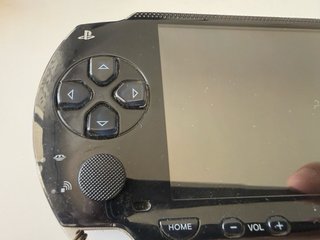 Sony PSP-1004 + Caricatore, Custodia e Accessori