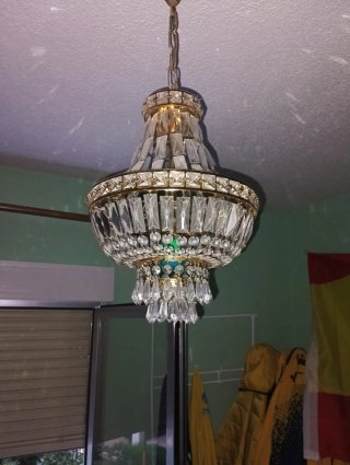 Lámpara de araña de cristal y metal