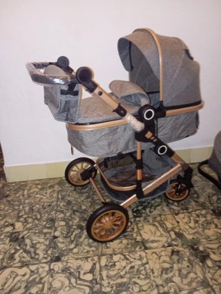Carrito de bebé y silla coche gris