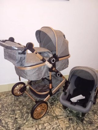 Carrito de bebé y silla coche gris