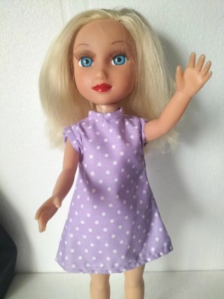 Muñeca rubia ojos grandes antigua